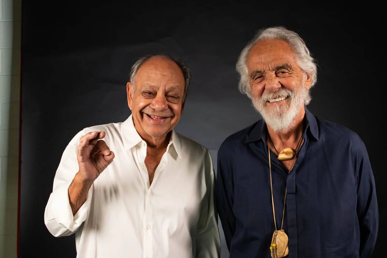 Cheech Marin and Tommy Chong smiling and waving hello